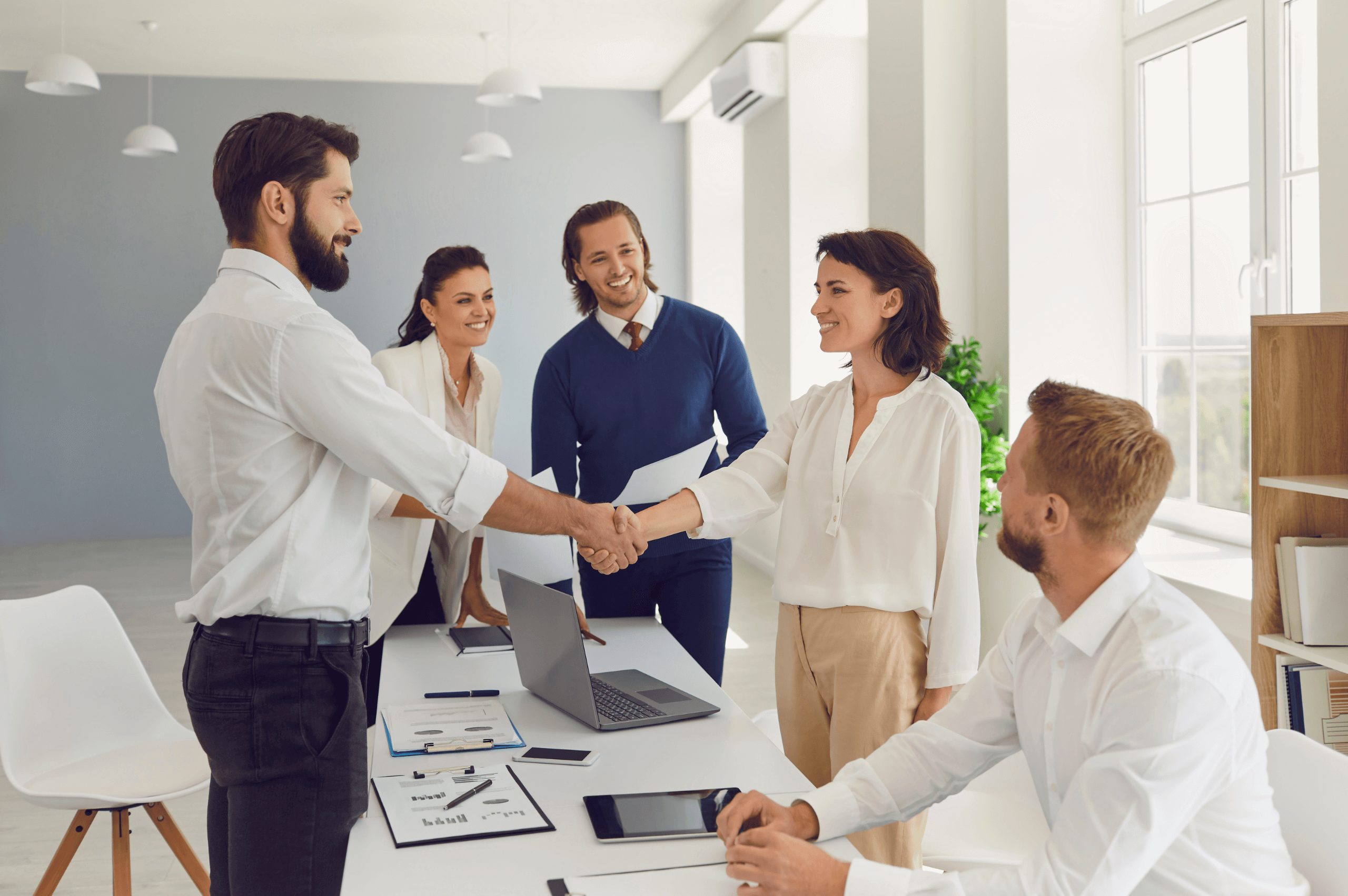 Business people shaking hands confirming a business deal in a negotiation meeting