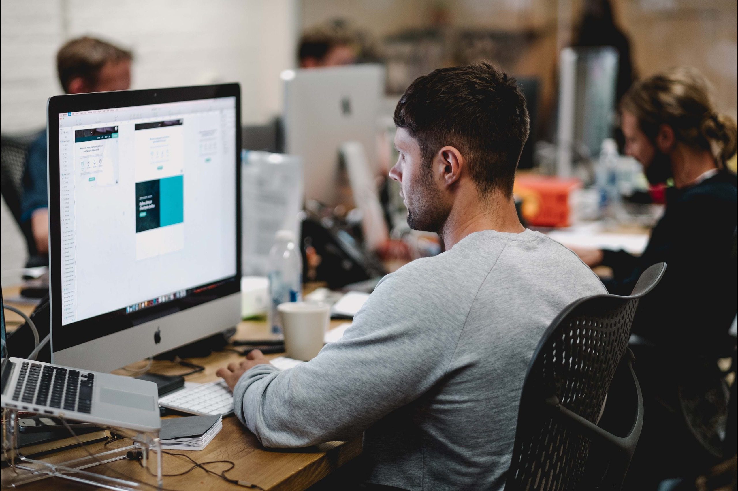 A web design company employee working in an office