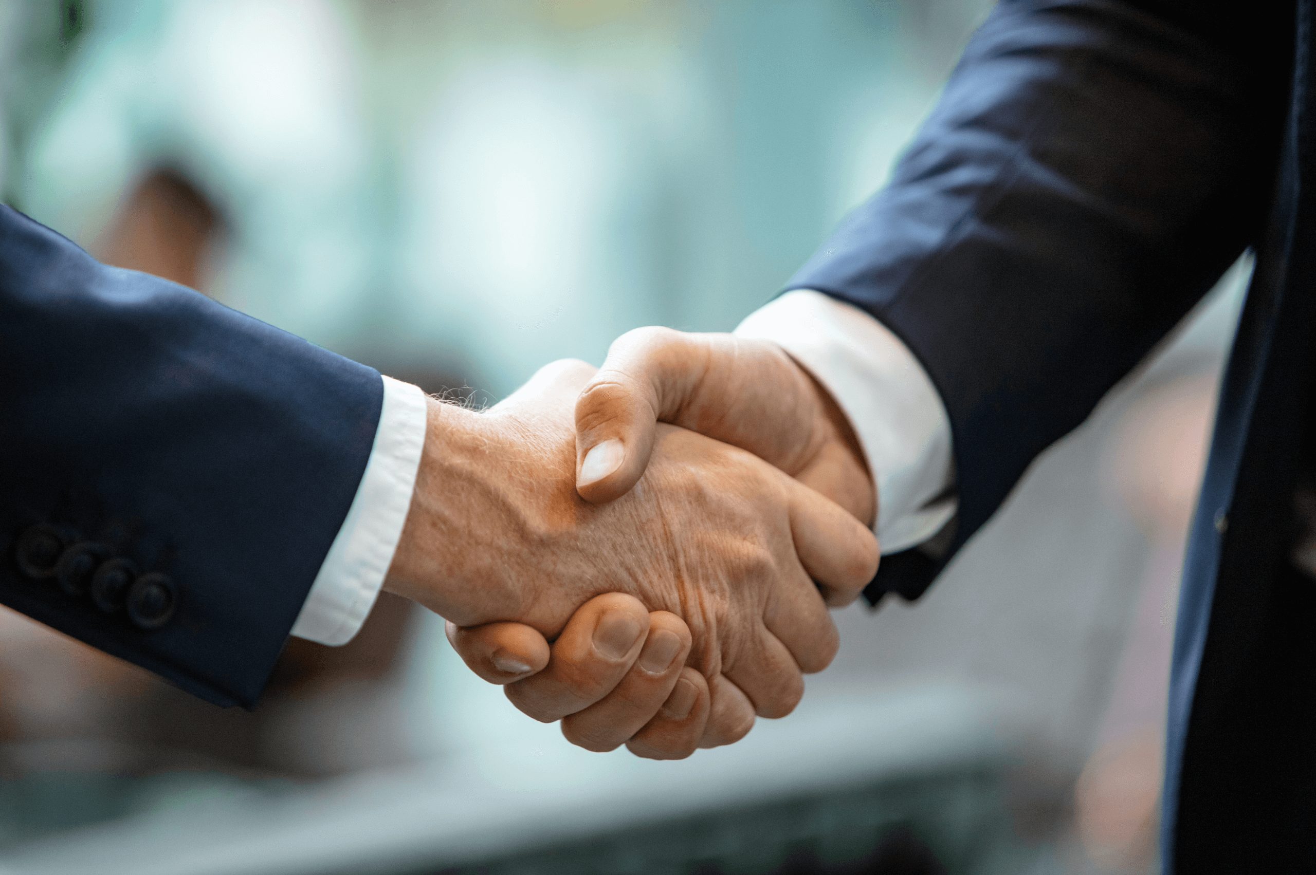 Two men shaking hands showing business trust and agreement